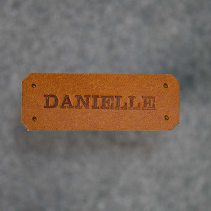 Close up image of Danielle name tag in Golden Brown
