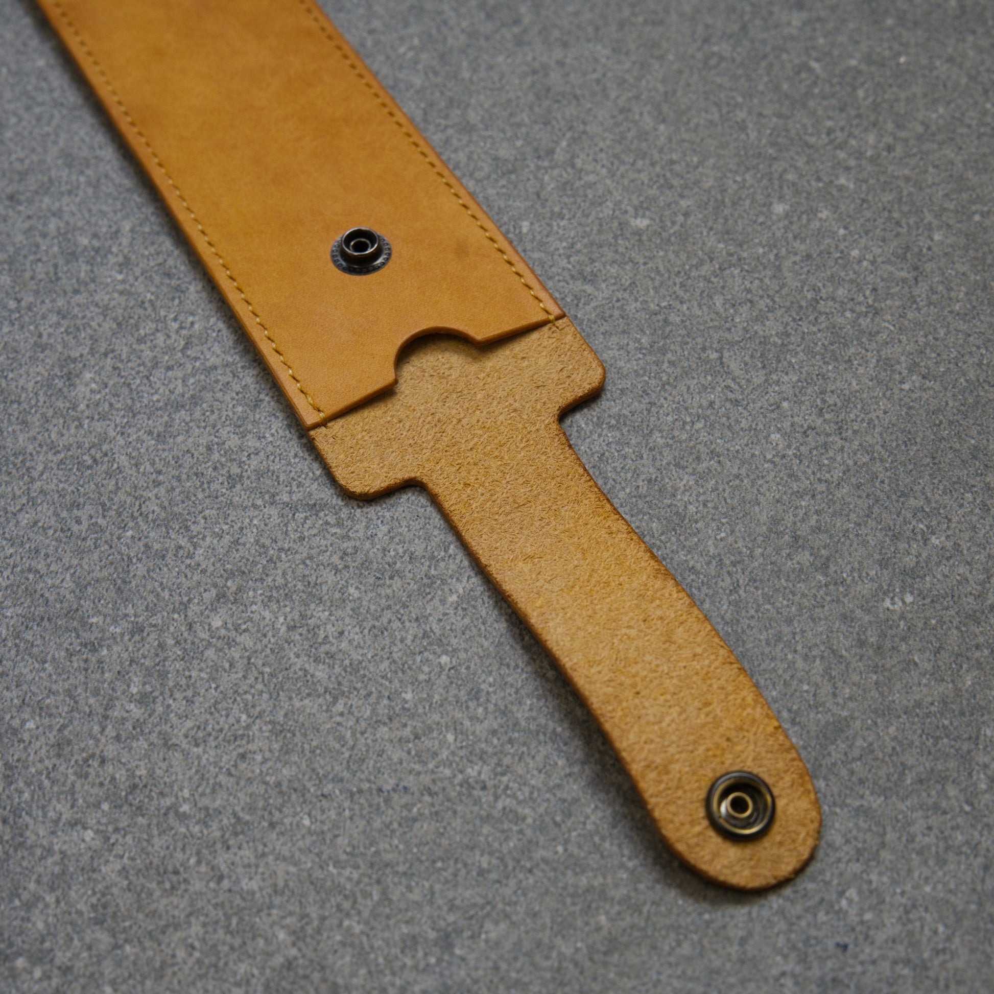 Close-up of a yellow leather sheath lid