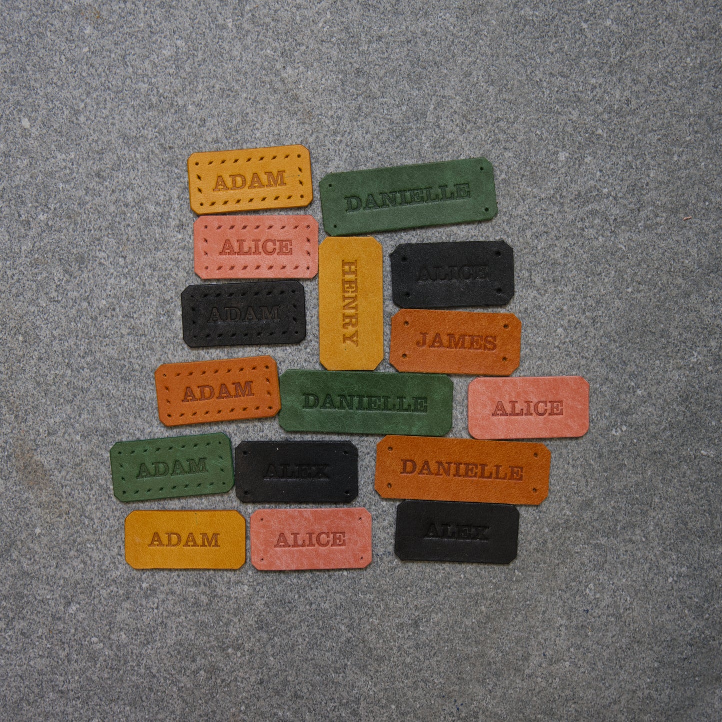 Colorful name tags on a gray surface