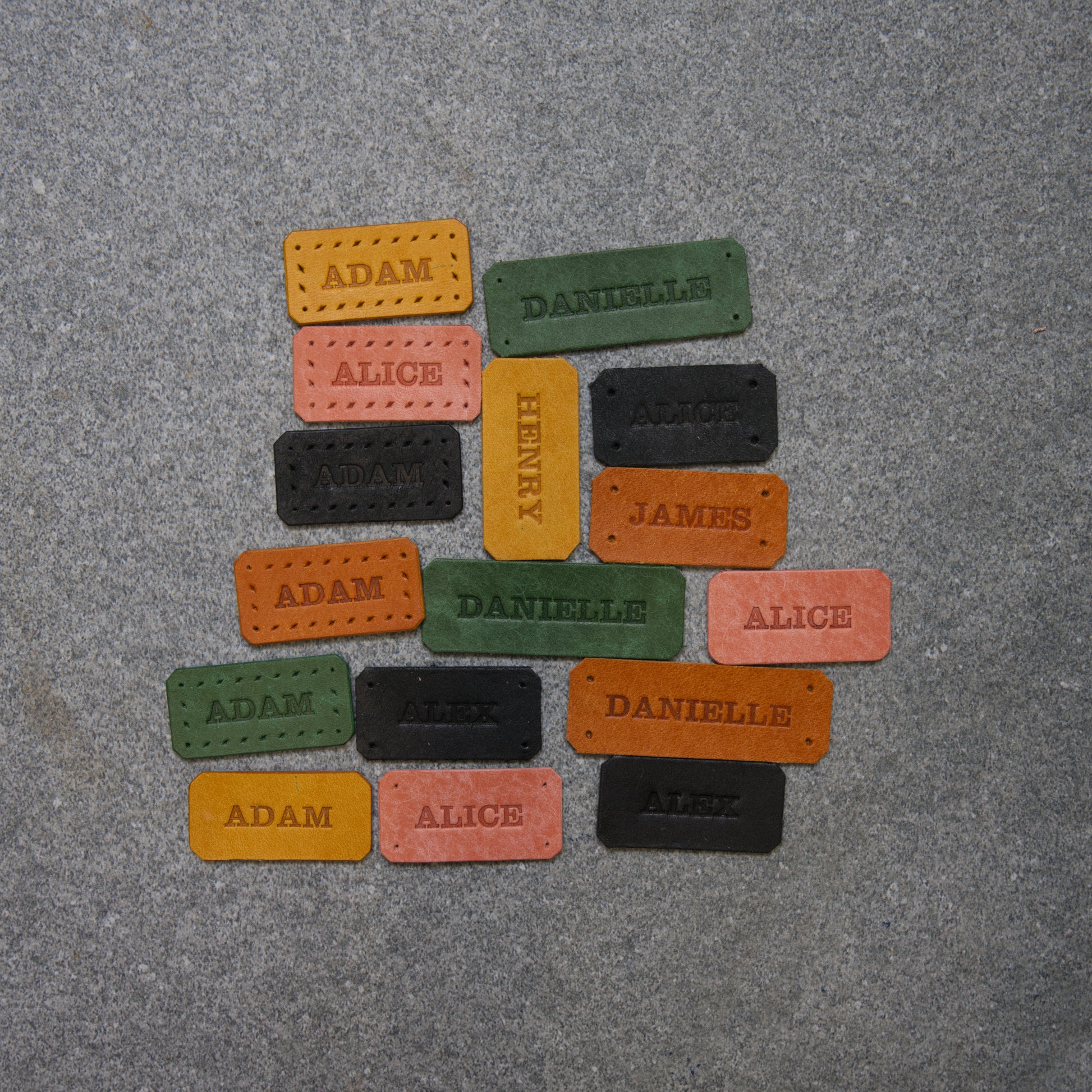 Colorful name tags on a gray surface